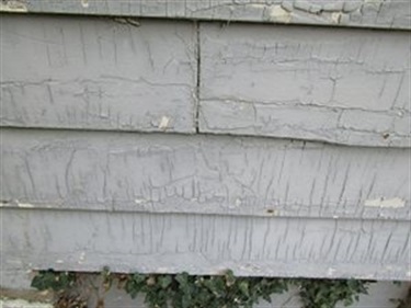 Old Paint on the Side of a House