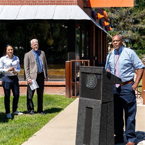 An event photograph of Mayor Tyrone Garner speaking at a podium