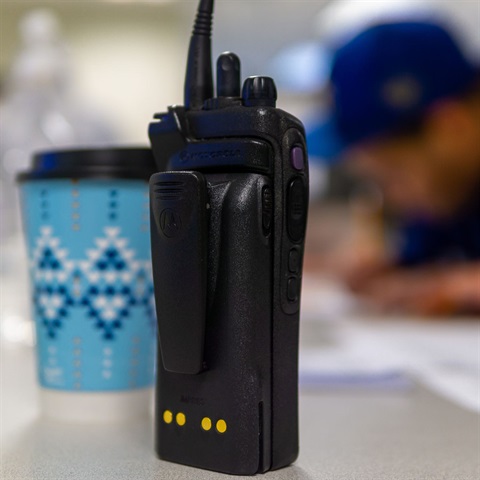 Photograph of a radio being used during winter weather operations