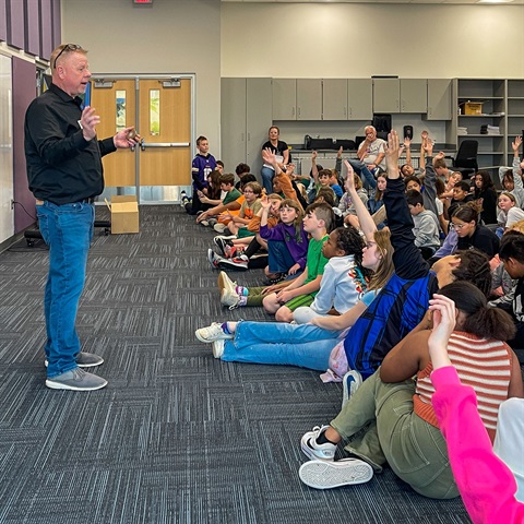 A photograph of Water Pollution Control Director Jeff Miles speaking to 5th-grade students at Piper Elementary School about water quality and wastewater treatment