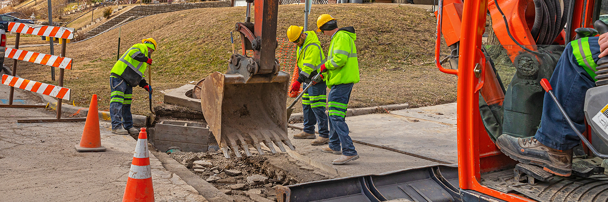 Photograph of Environmental Services team members working on a sewer construction project